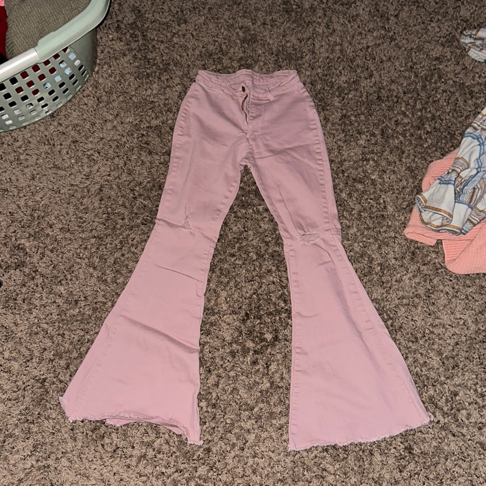 pink/salmon ripped flared jeans